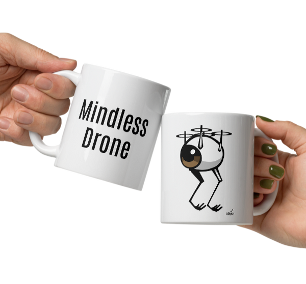 Two white ceramic mugs held in hands, one  with an image of an eyeball as a flying drone the other with the words "Mindless Drone"