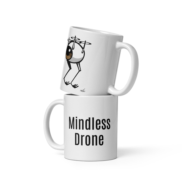 Two white ceramic mugs stacked, one with an image of an eyeball as a flying drone the other with the words "Mindless Drone"